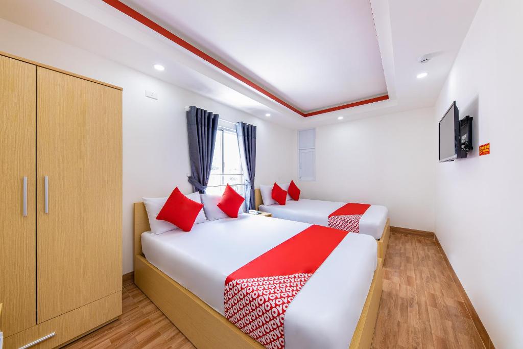 Postel nebo postele na pokoji v ubytování M&C Hotel Nha Trang
