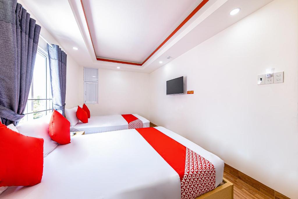 Postel nebo postele na pokoji v ubytování M&C Hotel Nha Trang