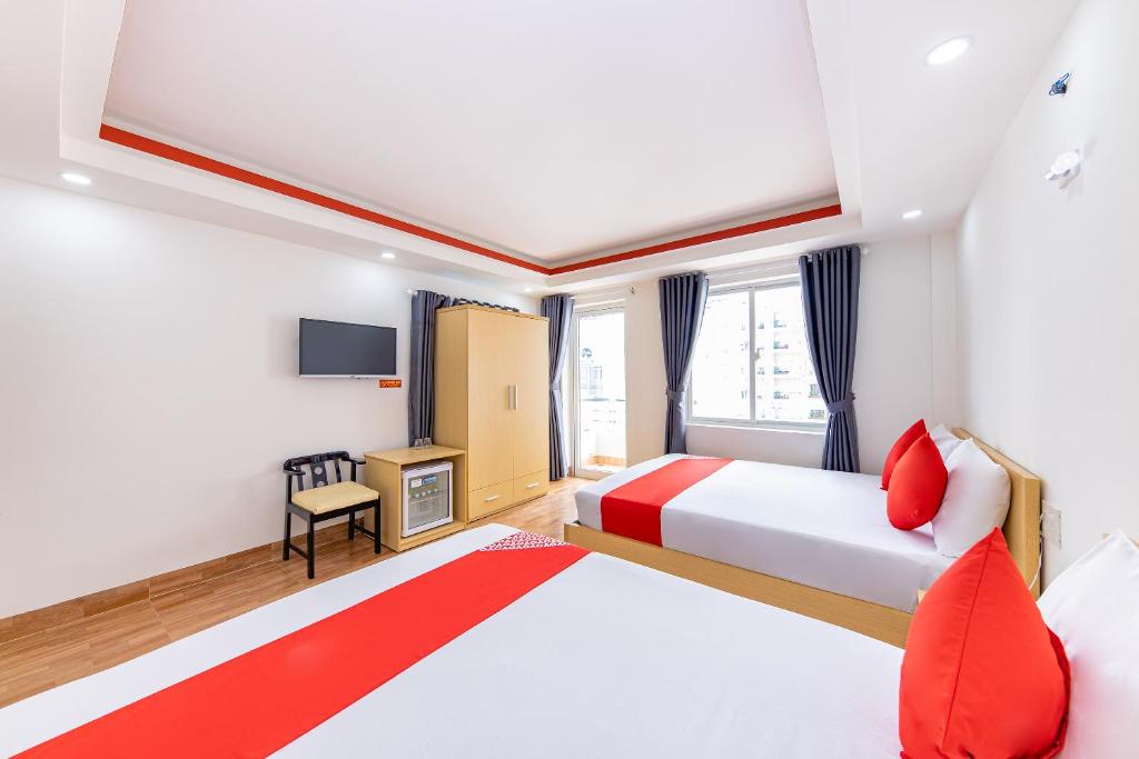 Postel nebo postele na pokoji v ubytování M&C Hotel Nha Trang