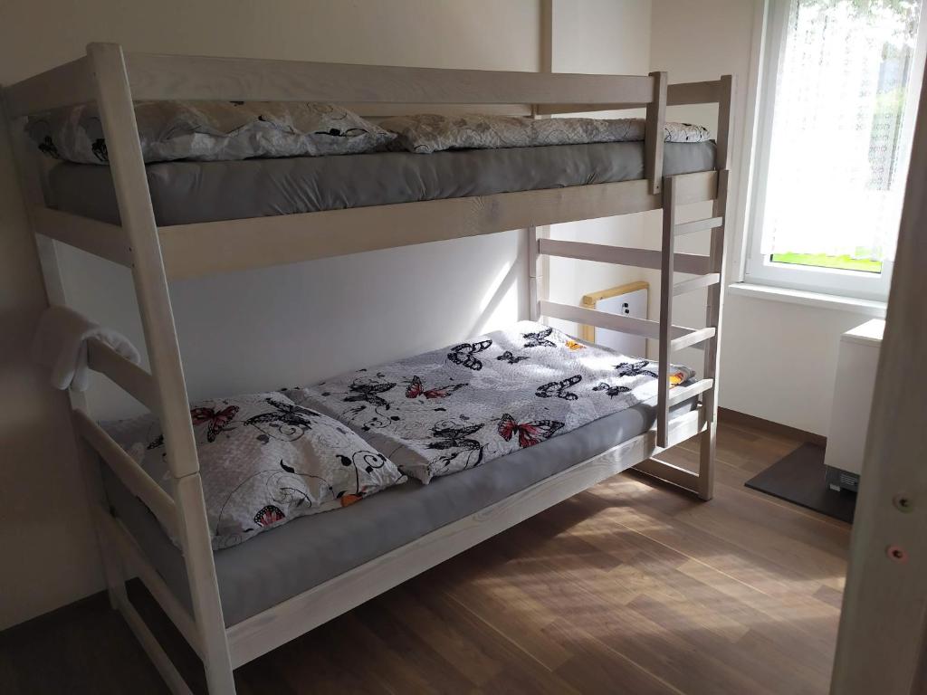 Postel nebo postele na pokoji v ubytování Statek Český Dvůr