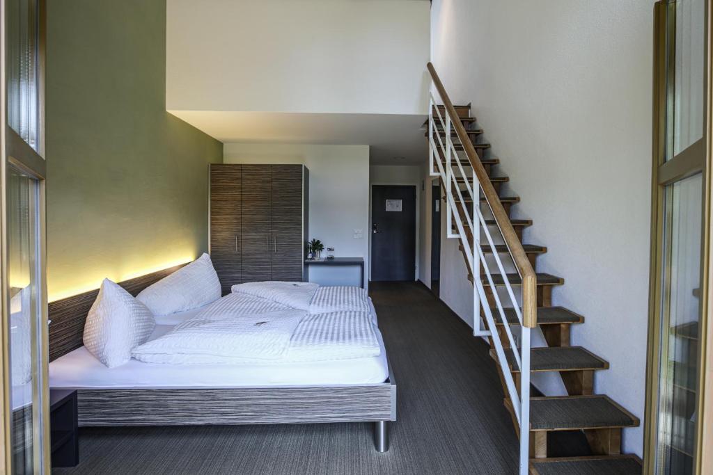 Postel nebo postele na pokoji v ubytování Hotel Restaurant Seegarten