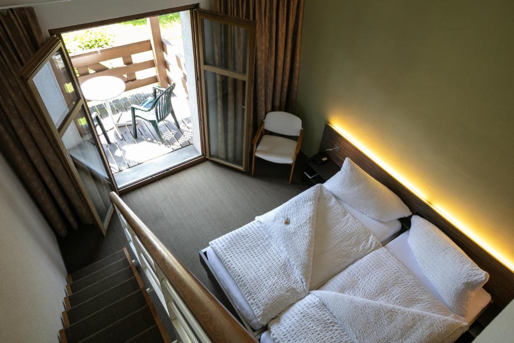 Postel nebo postele na pokoji v ubytování Hotel Restaurant Seegarten