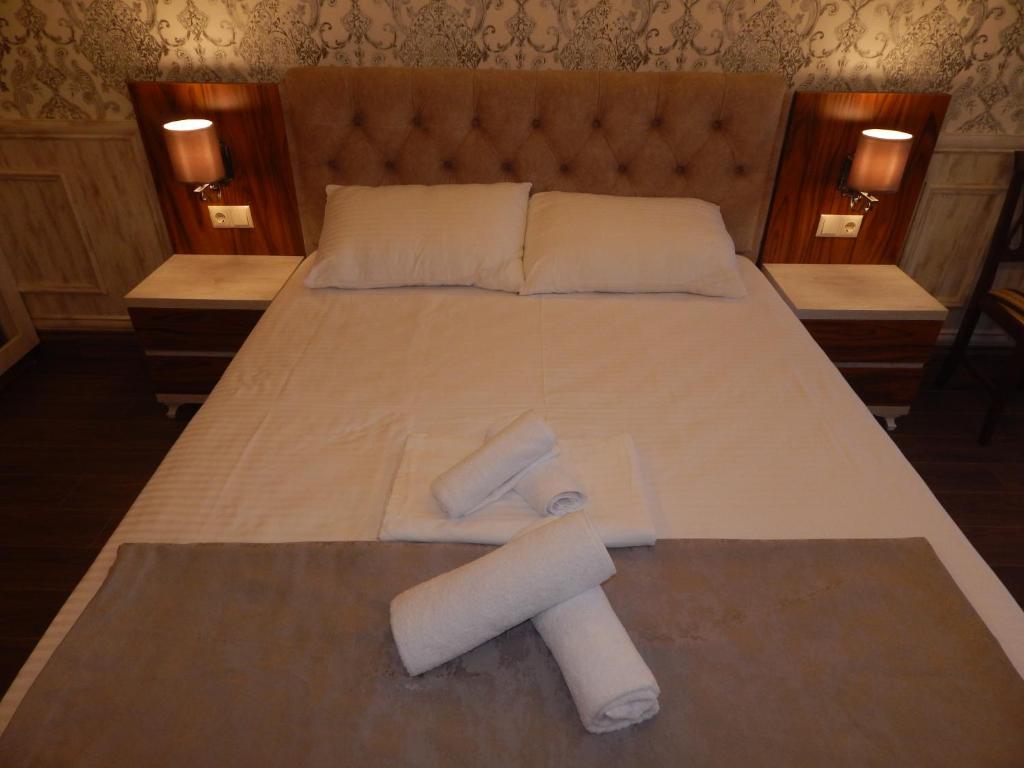 Postel nebo postele na pokoji v ubytování MELINI Boutique Hotel