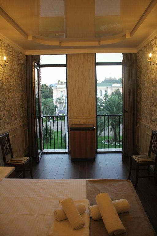 Postel nebo postele na pokoji v ubytování MELINI Boutique Hotel