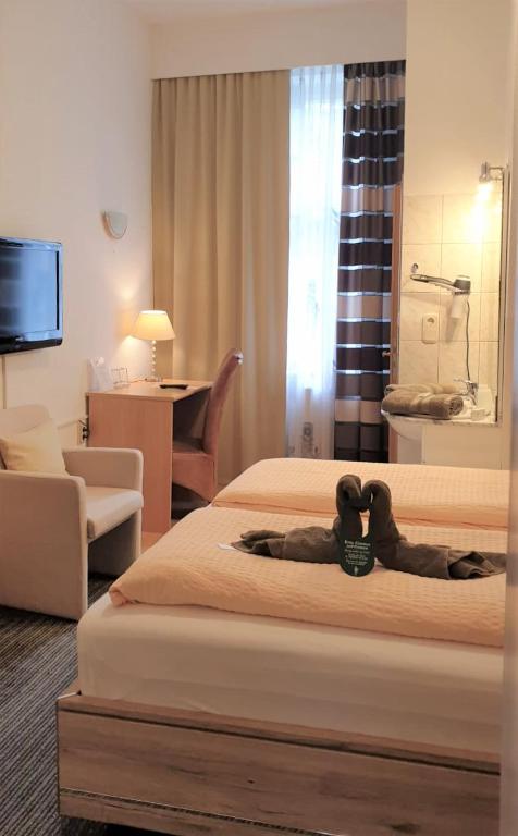 Postel nebo postele na pokoji v ubytování Hotel Antoni