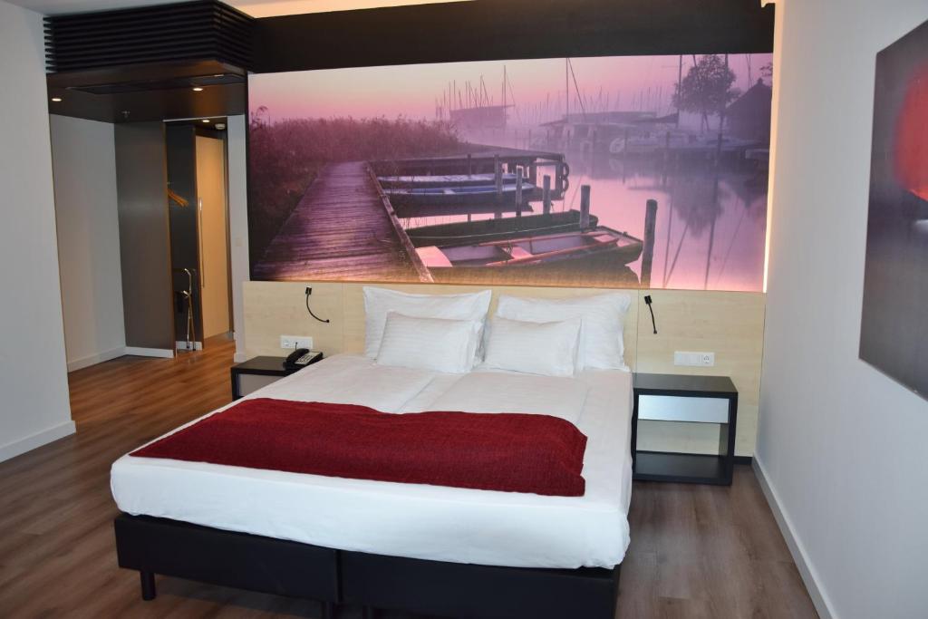 A bed or beds in a room at Pannonia Tower