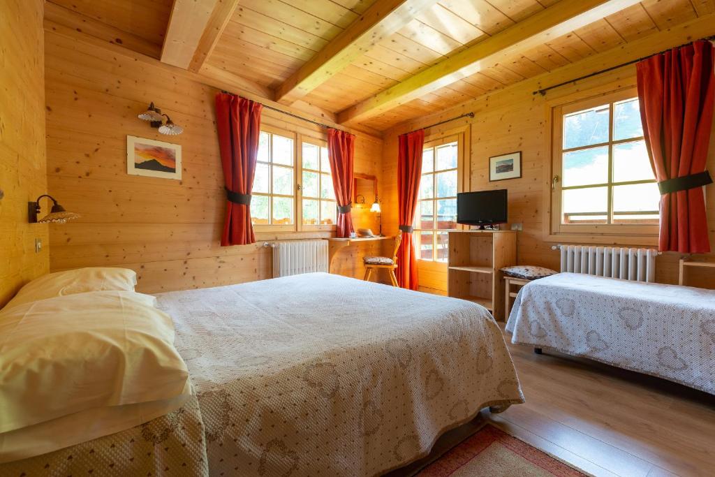 Postel nebo postele na pokoji v ubytování Baita De Mario