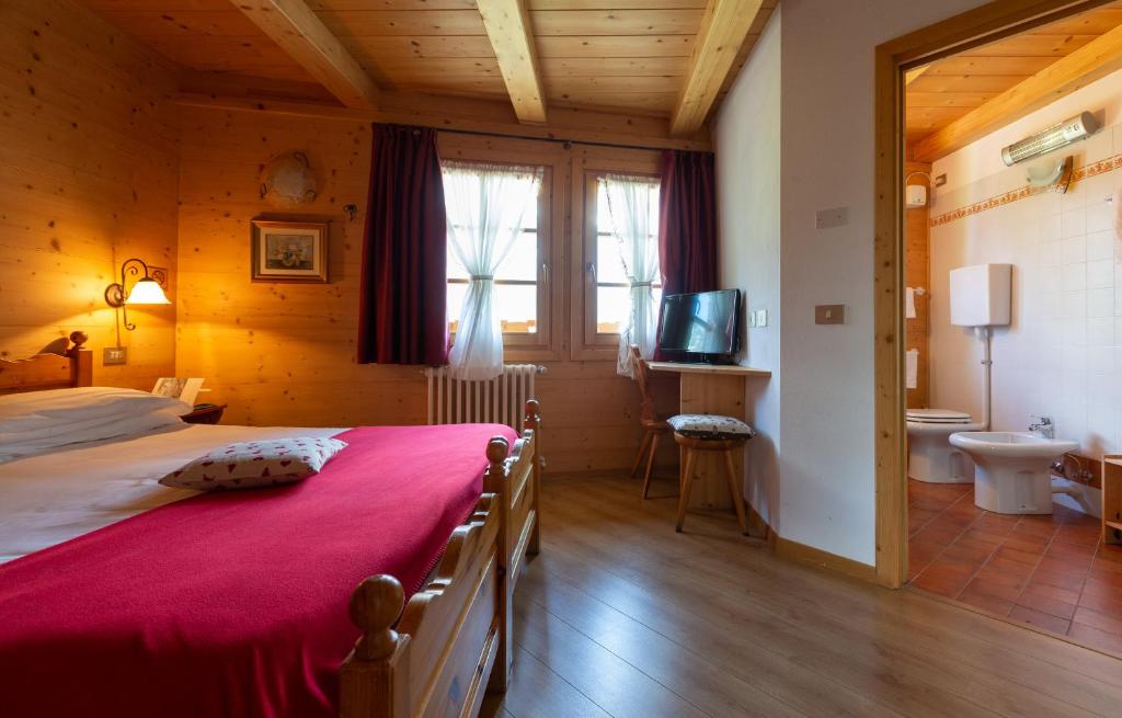 Postel nebo postele na pokoji v ubytování Baita De Mario