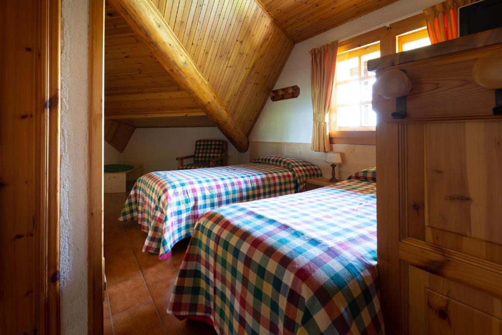 Postel nebo postele na pokoji v ubytování Baita De Mario