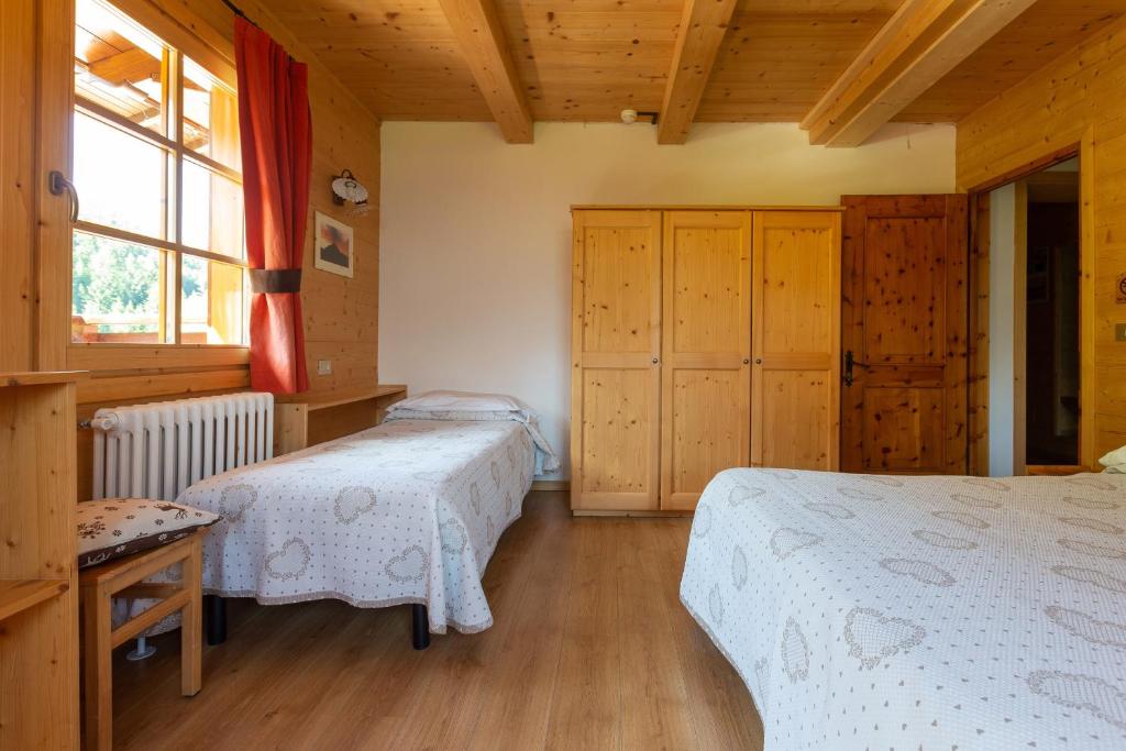 Postel nebo postele na pokoji v ubytování Baita De Mario