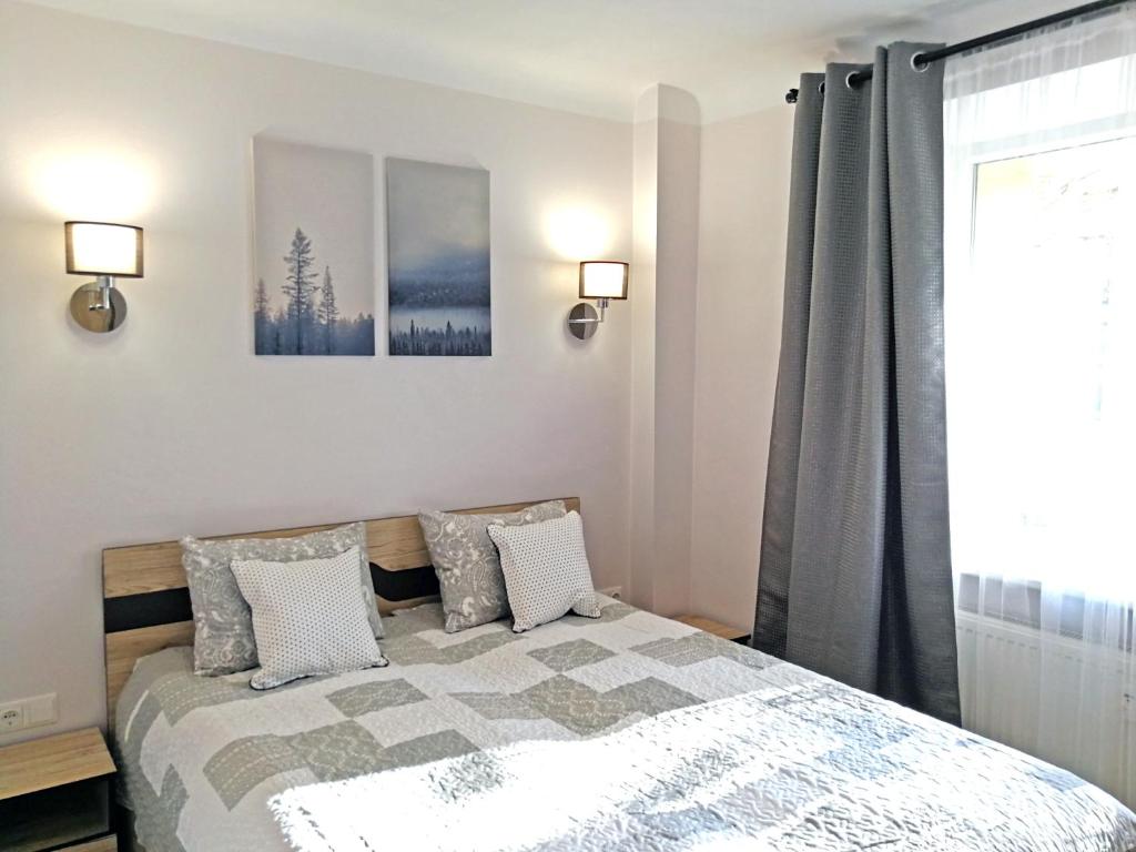 Šiauliai Central Spot Apartment - Draugystes pr. tesisinde bir odada yatak veya yataklar