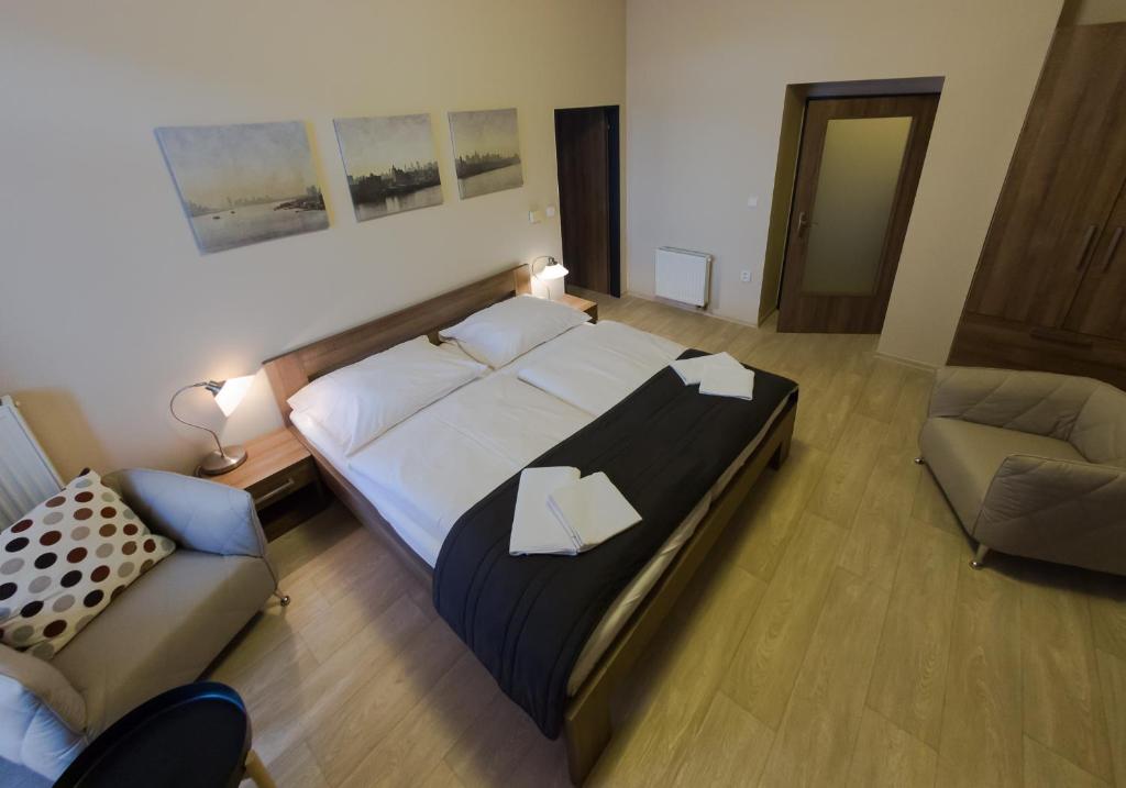 Postel nebo postele na pokoji v ubytování Penzion Apartmány Resident