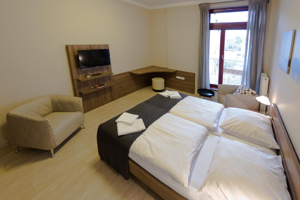 Postel nebo postele na pokoji v ubytování Penzion Apartmány Resident