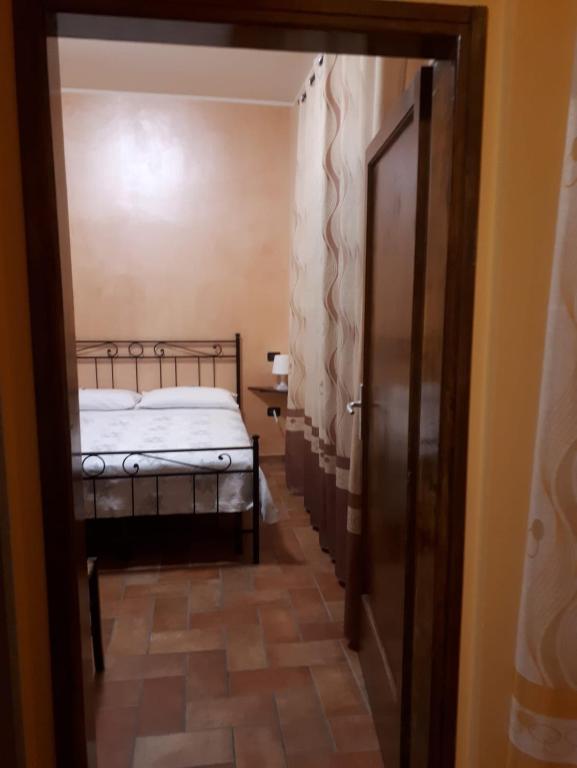 Łóżko lub łóżka w pokoju w obiekcie La Casa dei Nonni