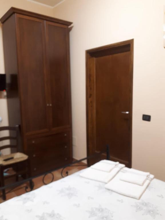 Łóżko lub łóżka w pokoju w obiekcie La Casa dei Nonni