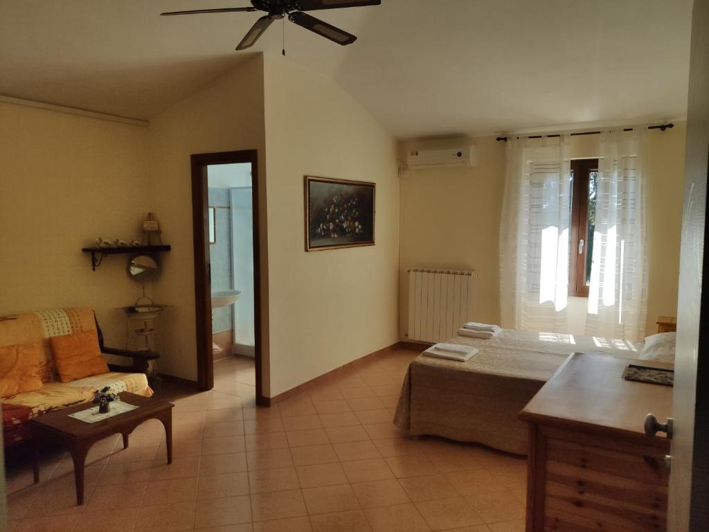 Postel nebo postele na pokoji v ubytování Agriturismo Zugarelli