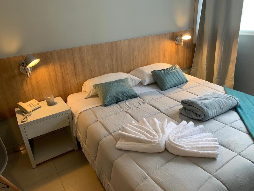 Postel nebo postele na pokoji v ubytování Urbano Hotel