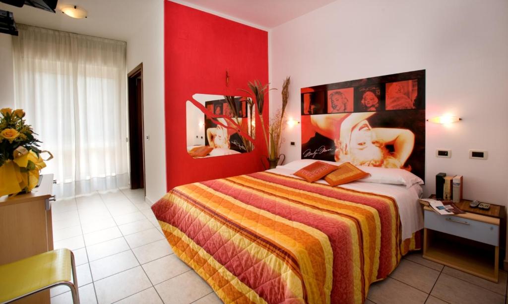 מיטה או מיטות בחדר ב-Hotel Villa Cesare B&B