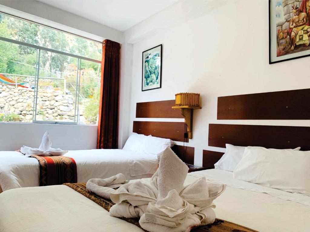 Postel nebo postele na pokoji v ubytování Inka Khawarina Tambo Lodge