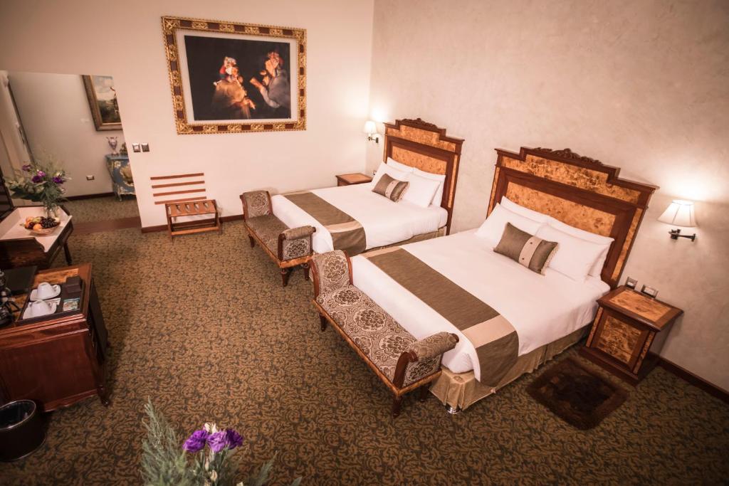 Postel nebo postele na pokoji v ubytování Aranwa Cusco Boutique Hotel