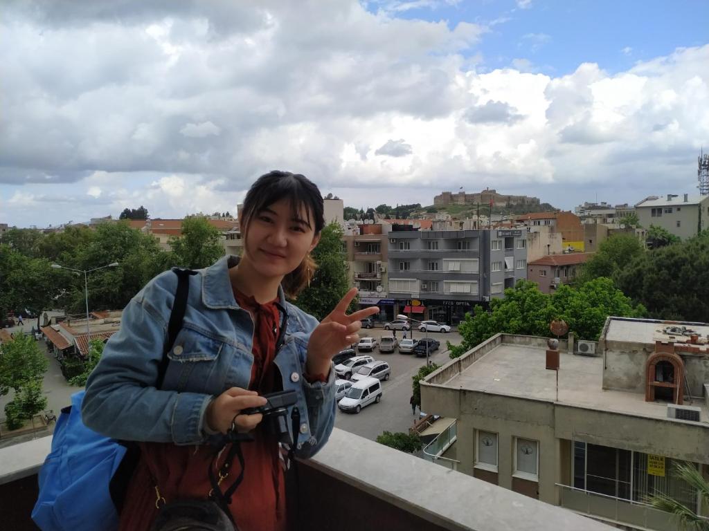 a woman standing on top of a building at EPHESUS CENTRUM in Selcuk