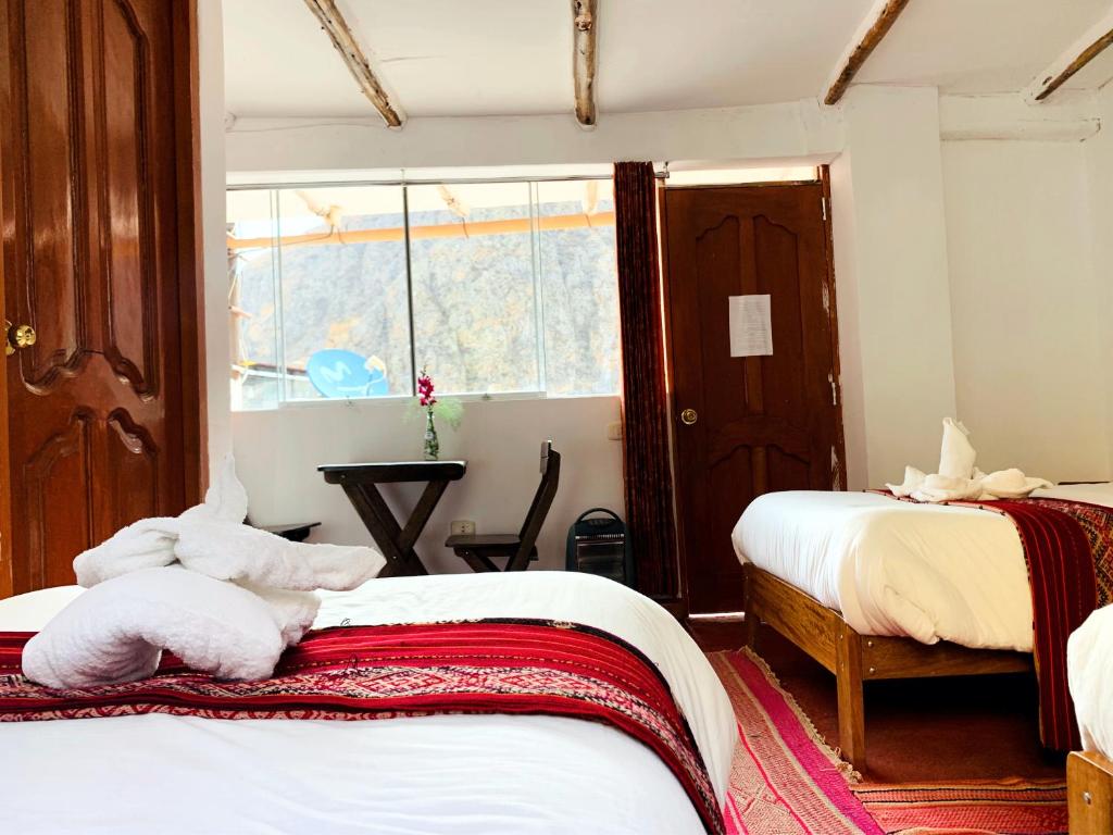 Postel nebo postele na pokoji v ubytování Inka Khawarina Tambo Lodge