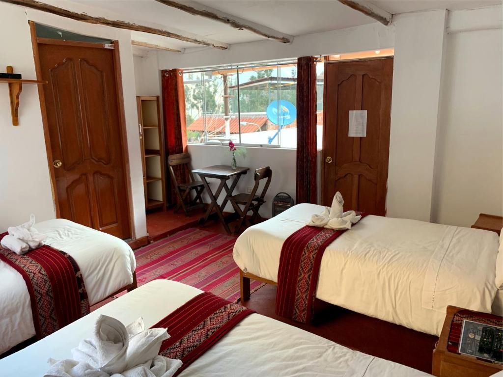 Postel nebo postele na pokoji v ubytování Inka Khawarina Tambo Lodge