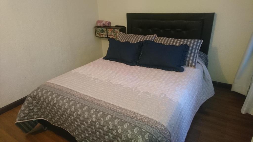 Postel nebo postele na pokoji v ubytování Aloha