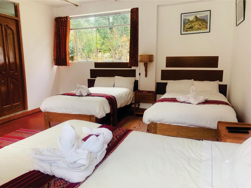 Postel nebo postele na pokoji v ubytování Inka Khawarina Tambo Lodge
