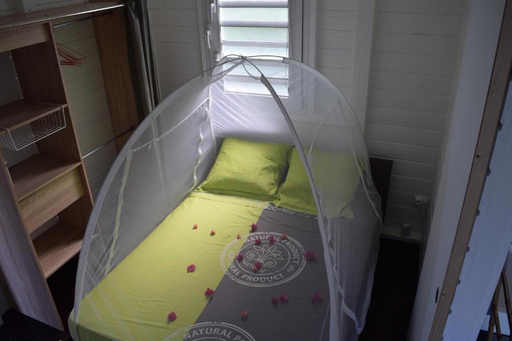 Postel nebo postele na pokoji v ubytování Bungalow la paillote