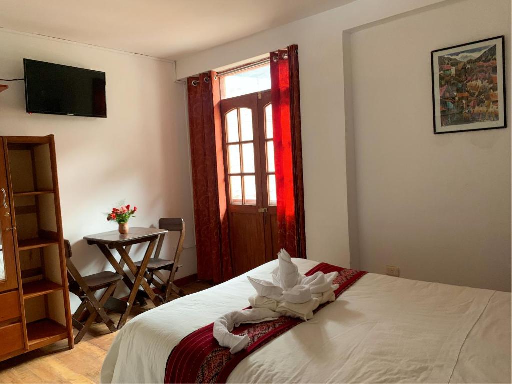 Postel nebo postele na pokoji v ubytování Inka Khawarina Tambo Lodge