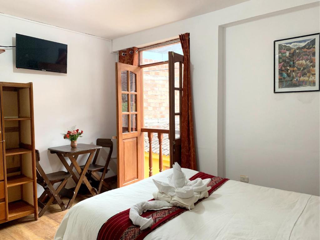 Postel nebo postele na pokoji v ubytování Inka Khawarina Tambo Lodge