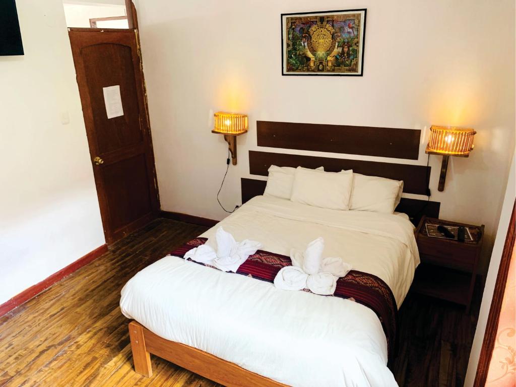 Postel nebo postele na pokoji v ubytování Inka Khawarina Tambo Lodge