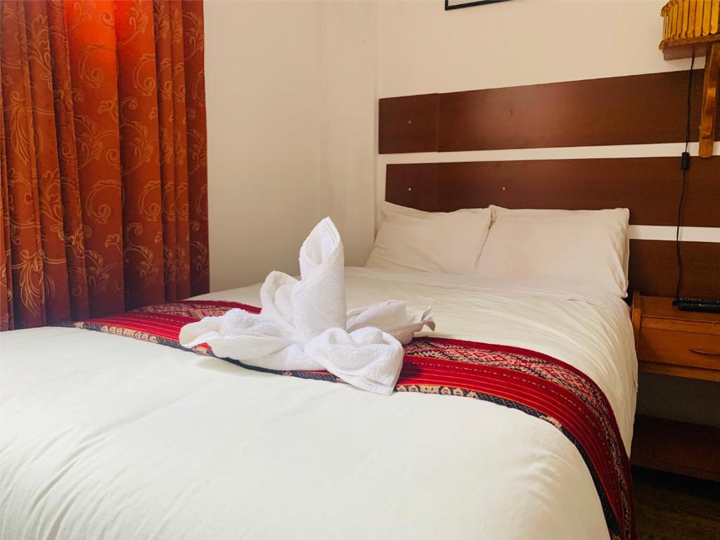 Postel nebo postele na pokoji v ubytování Inka Khawarina Tambo Lodge