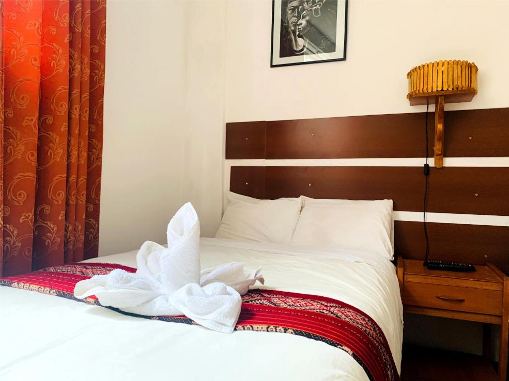 Postel nebo postele na pokoji v ubytování Inka Khawarina Tambo Lodge