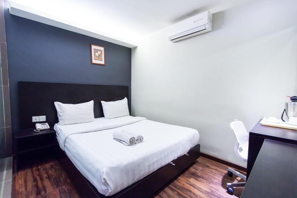 Postel nebo postele na pokoji v ubytování Hotel 99 Bandar Klang (Meru)