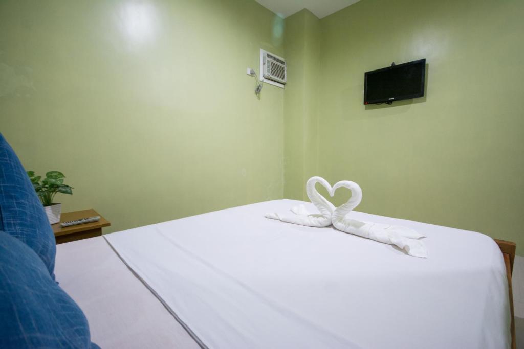 Postel nebo postele na pokoji v ubytování Boracay Backpackers