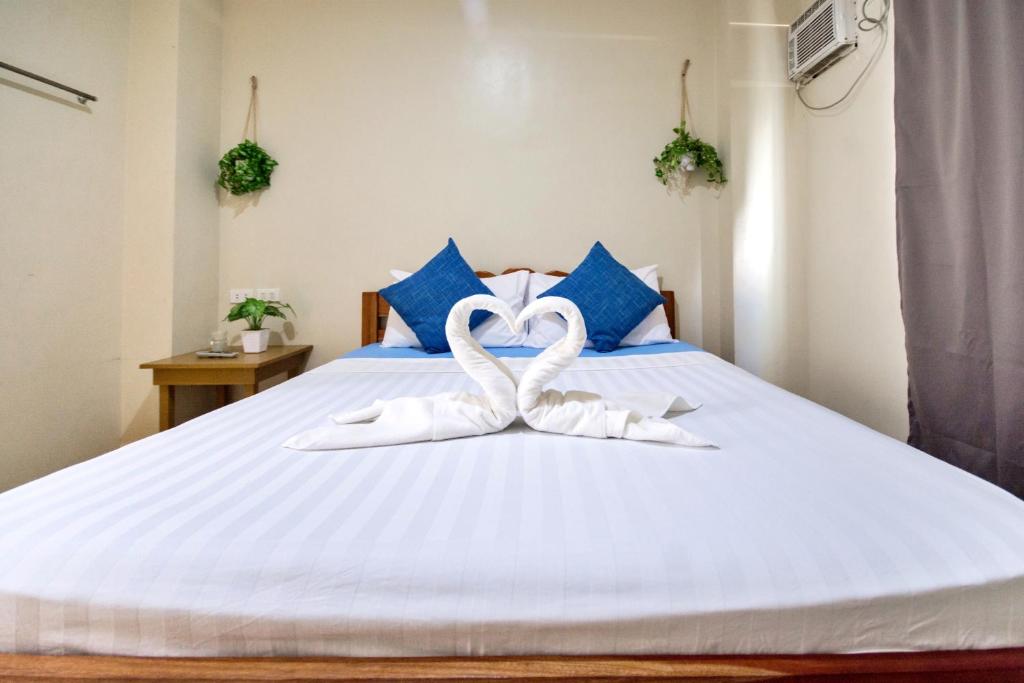 Postel nebo postele na pokoji v ubytování Boracay Backpackers