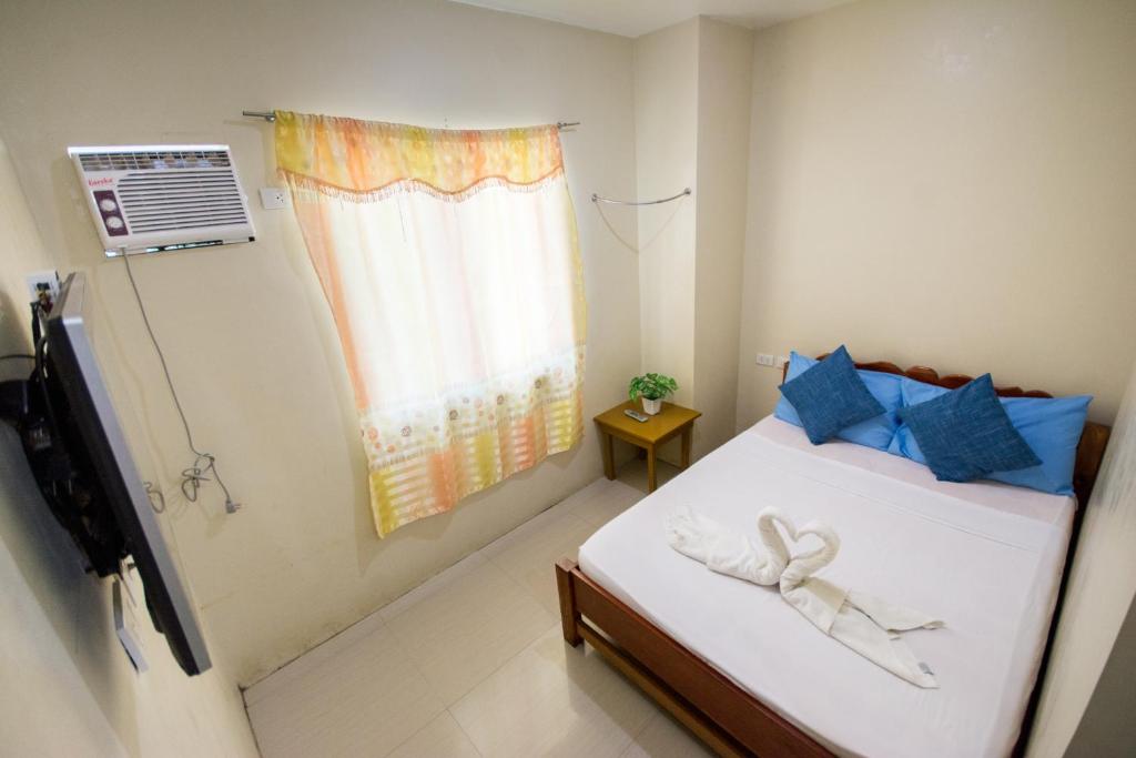 Postel nebo postele na pokoji v ubytování Boracay Backpackers