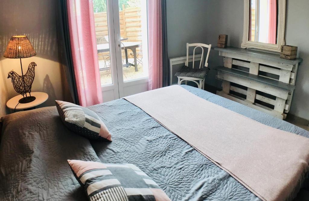 Postel nebo postele na pokoji v ubytování Gîtes Le Mas Guiraud