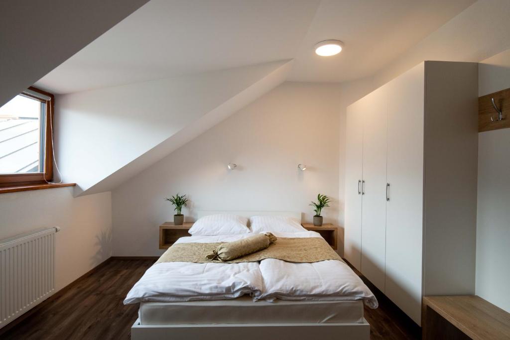 Postel nebo postele na pokoji v ubytování Guesthouse Stari Mayr