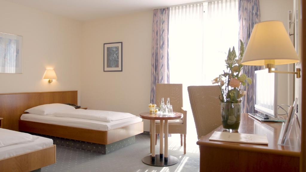 Postel nebo postele na pokoji v ubytování Hotel Blankenfeld