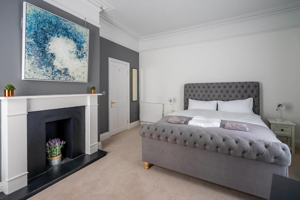 a bedroom with a bed and a fireplace at 123 Nunnery Lane in York