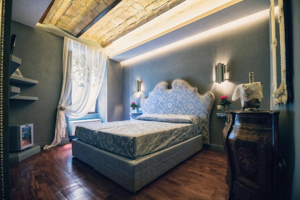 Postel nebo postele na pokoji v ubytování Hotel Antica Locanda