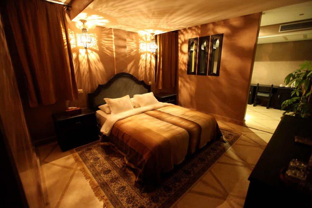 a bedroom with a large bed in a room at Riad Dar Haven in Tamraght Ou Fella