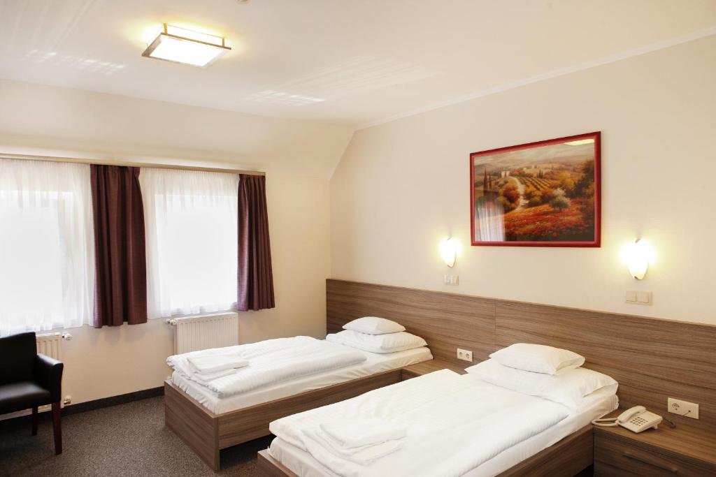 Postel nebo postele na pokoji v ubytování Paprika M1 Hotel