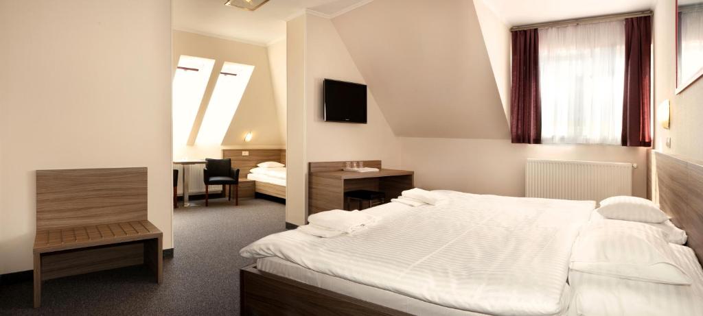Postel nebo postele na pokoji v ubytování Paprika M1 Hotel