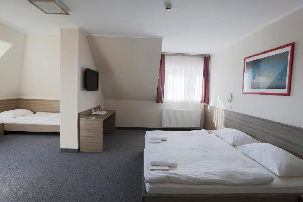 Postel nebo postele na pokoji v ubytování Paprika M1 Hotel