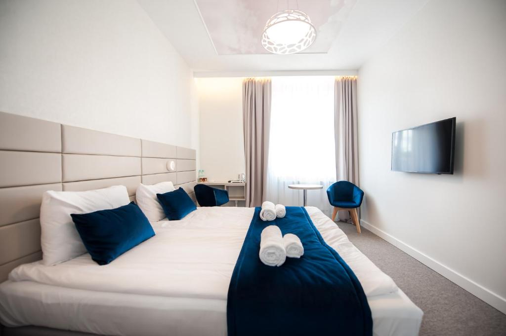 Postel nebo postele na pokoji v ubytování Hotel Gdynia Boutique