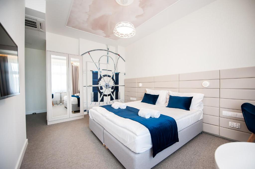 Postel nebo postele na pokoji v ubytování Hotel Gdynia Boutique